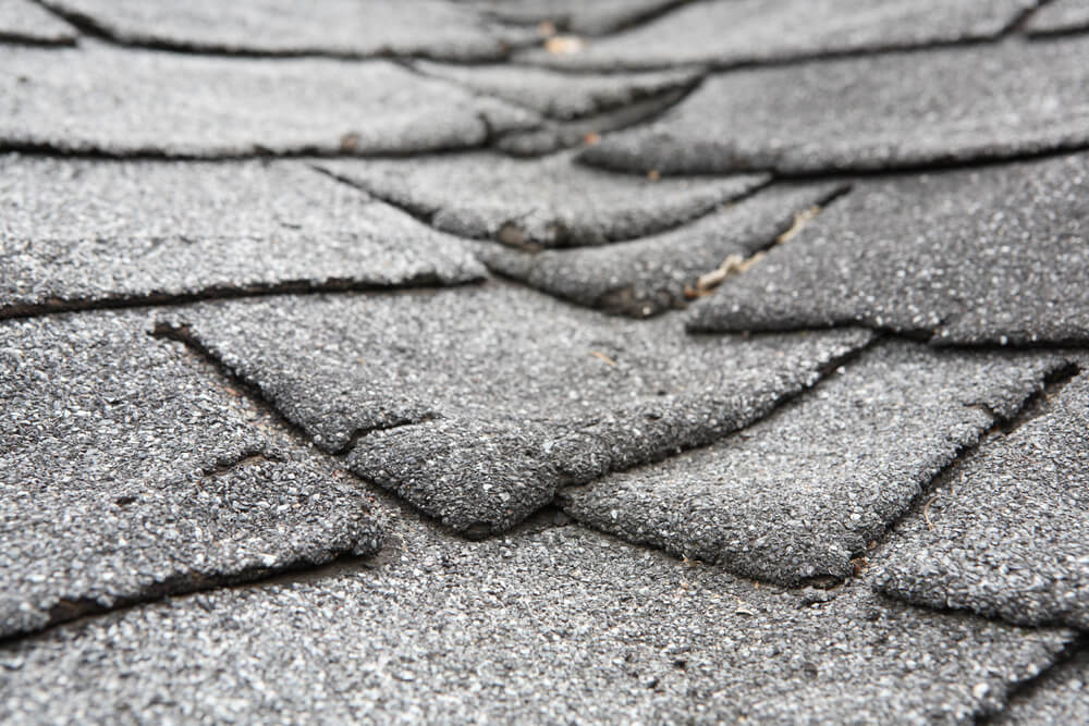 damaged old asphalt roof