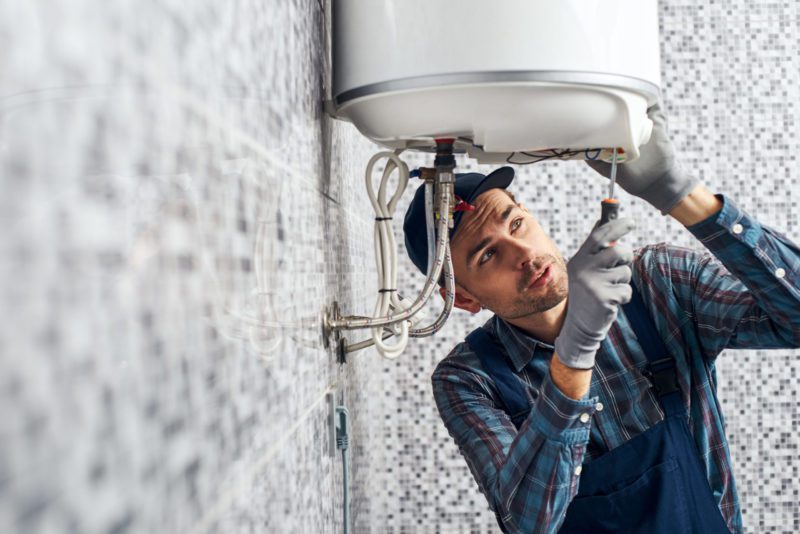 Man installing water heater