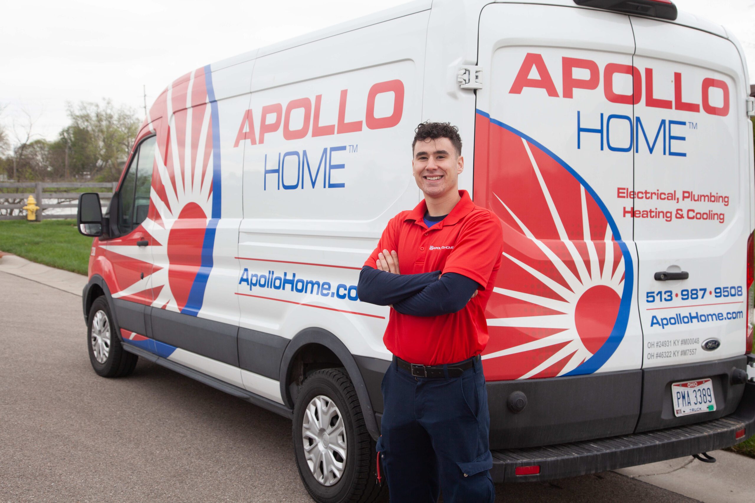 Technician in front of Apollo Home van