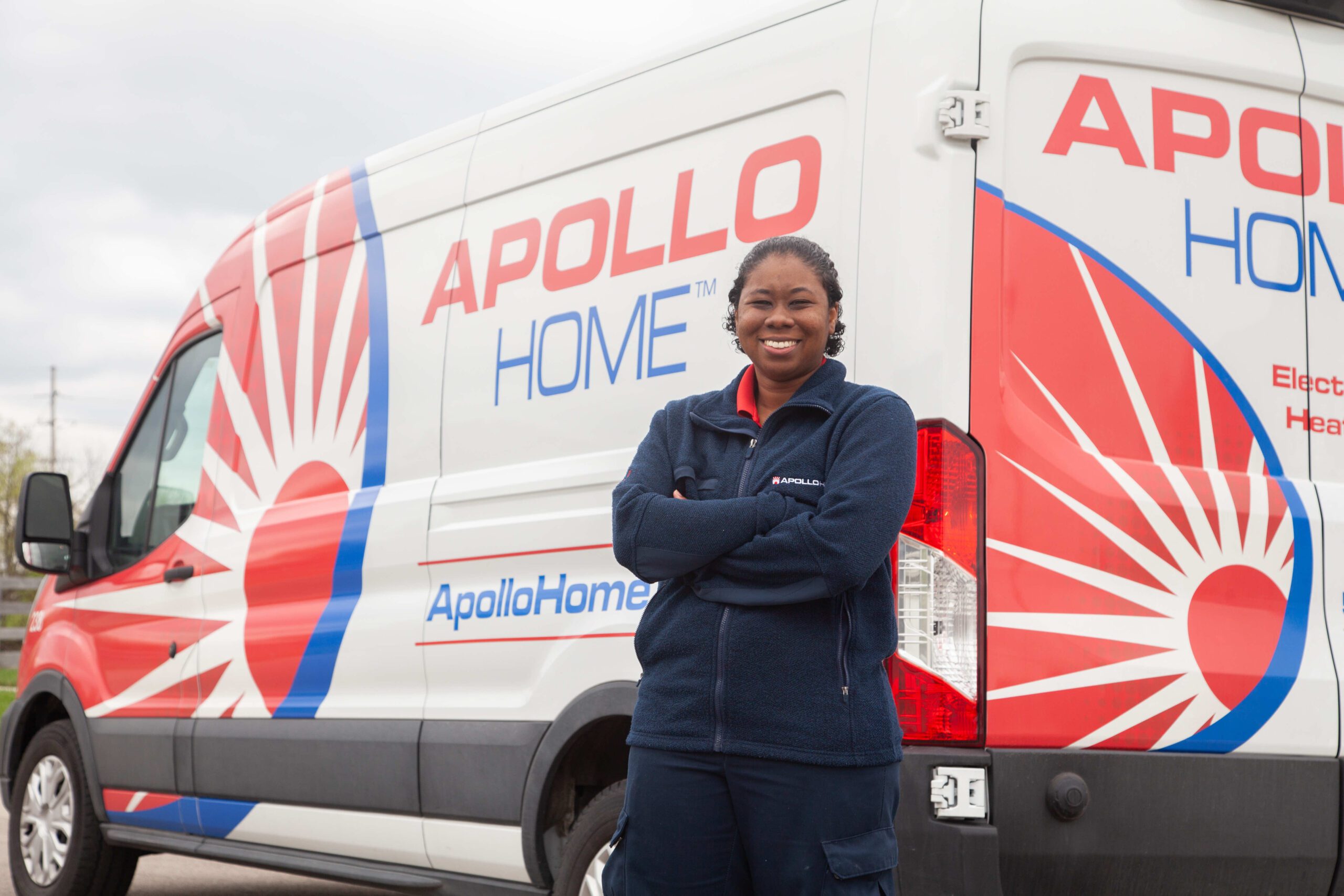 Employee in front of Apollo Home van